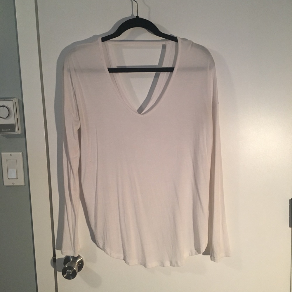 White long sleeved top with back cut out